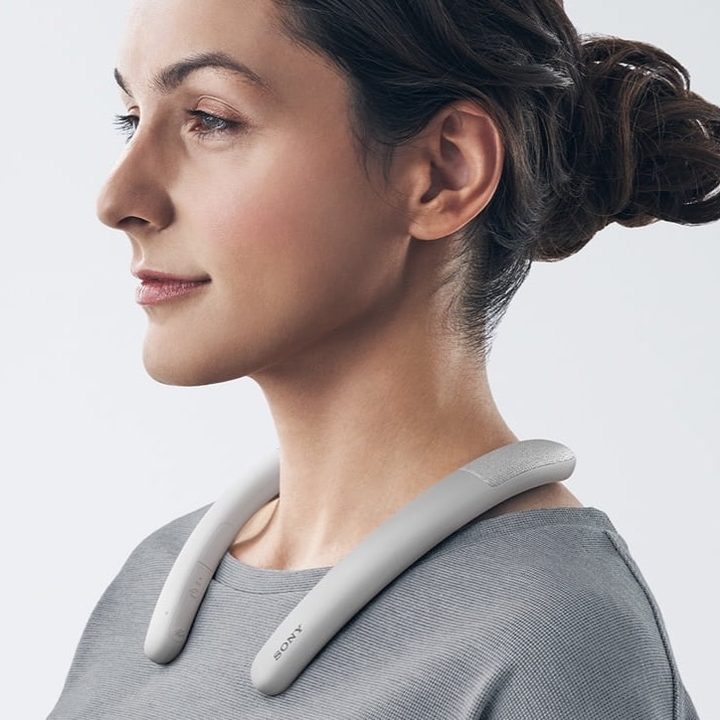 Woman wearing Sony SRS-NB10 neckband speaker.