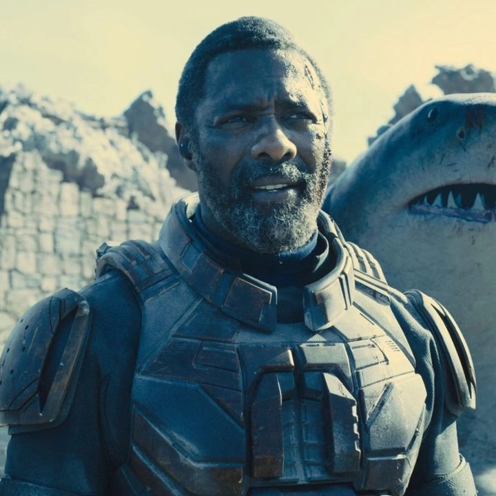 Idris Elba as Bloodsport with King Shark standing slightly behind him and to the right.