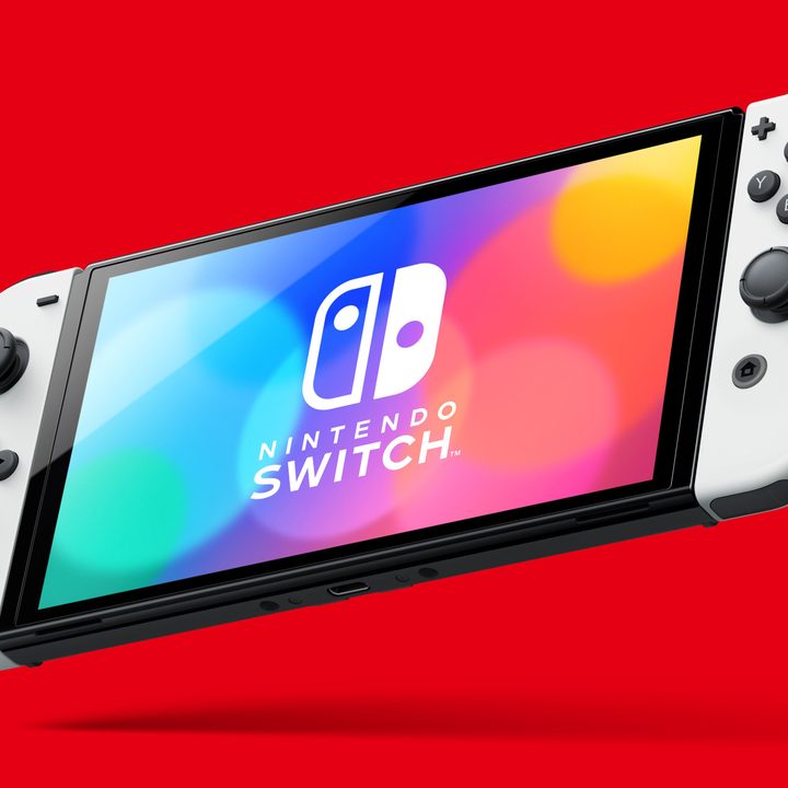 White Nintendo Switch OLED in handheld mode.
