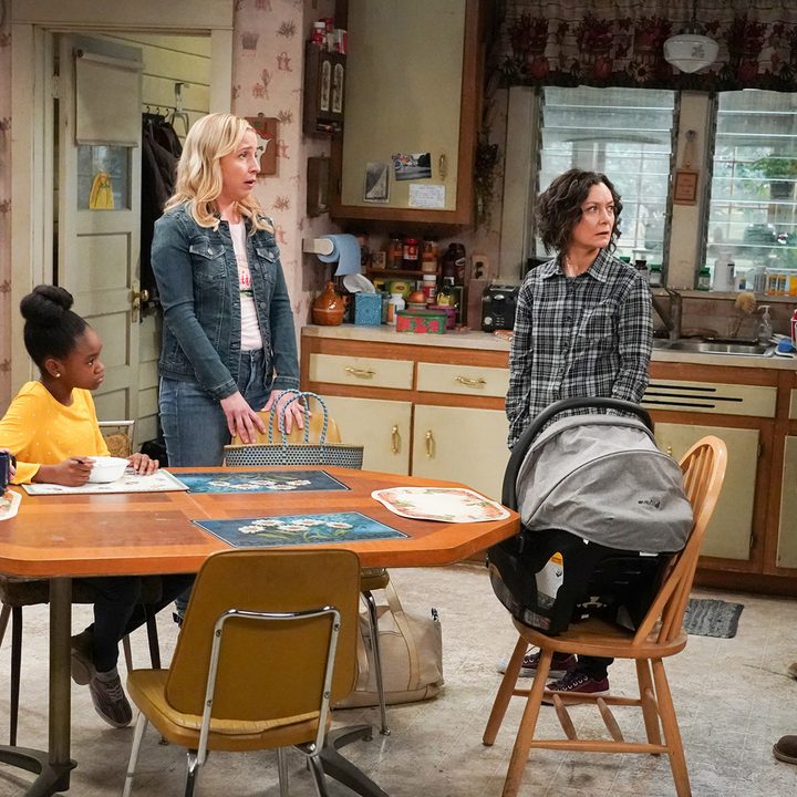 The Conners family standing in the kitchen on the revival series The Conners.