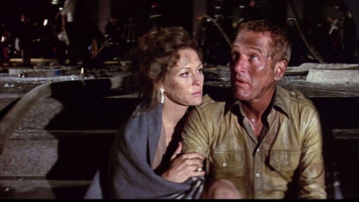 Two characters huddling together in The Towering Inferno.
