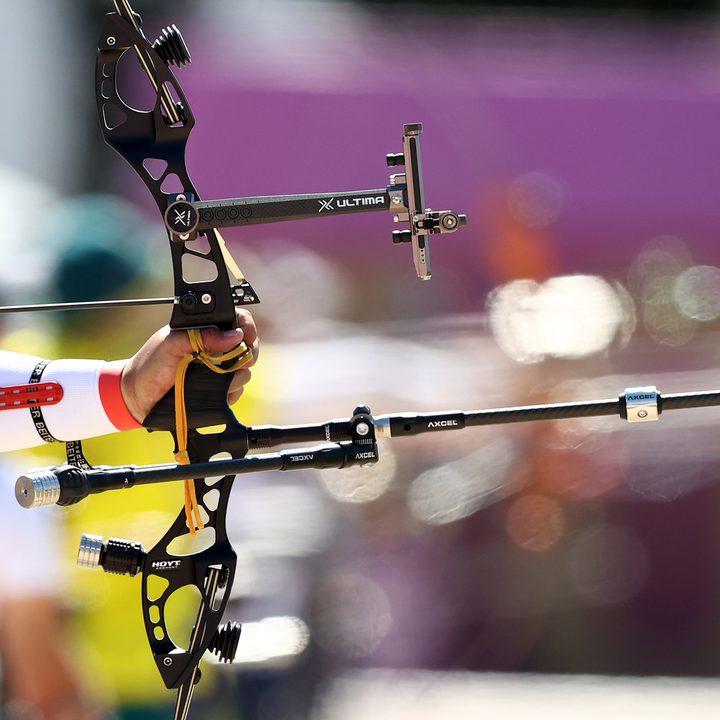 An athlete aims his bow during the men's individual archery ranking round held in Yumenoshima Park as part of the 2020 Summer Olympic Games.