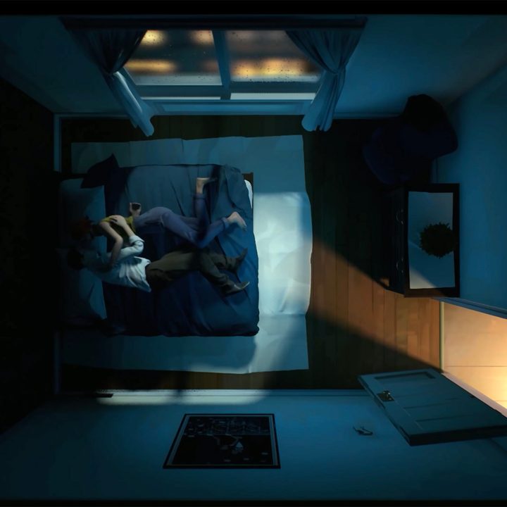 Two people talking in bed in 12 Minutes.