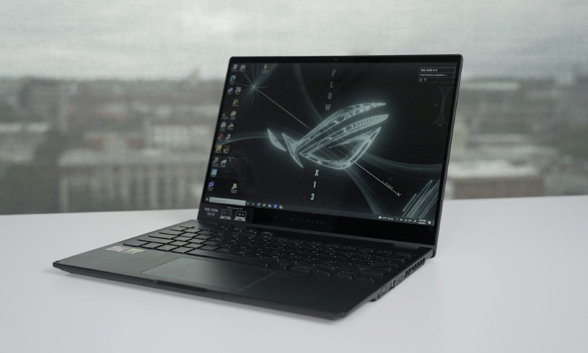 The ROG Flow X13 on a table overlooking a city.