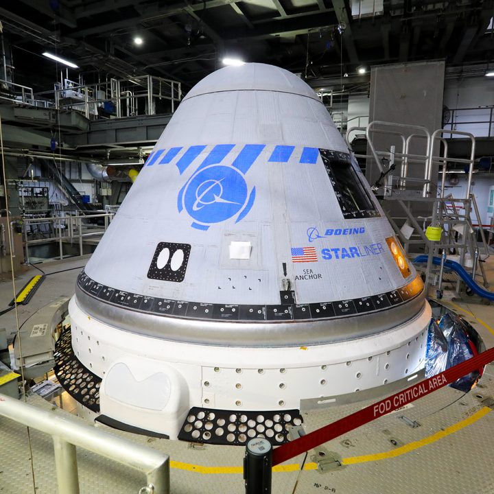 Boeing’s CST-100 Starliner spacecraft in the United Launch Alliance Vertical Integration Facility at Space Launch Complex 41.