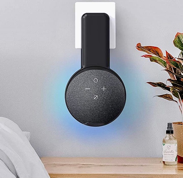 The Echo Dot Wall Mount Holder in a bedroom.