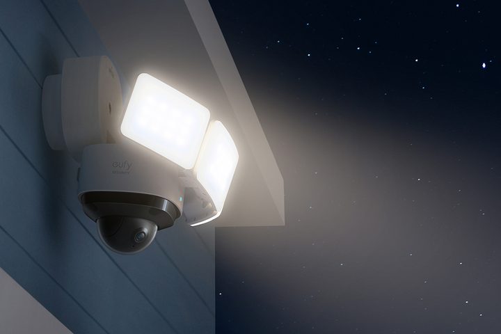 Eufy Floodlight Camera 2 Pro turned on and installed on side of building.