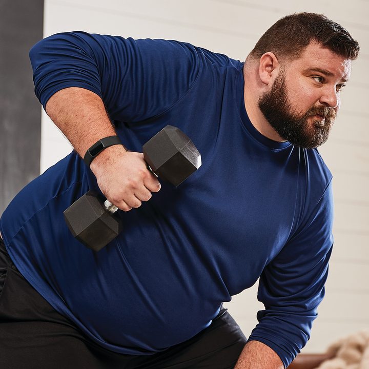Fitbit Charge 5 on wrist while working out.