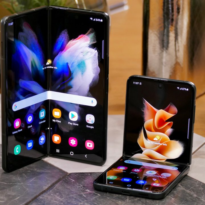 Galaxy Z Fold 3 and Z Flip 3 seen from the front with open screens.