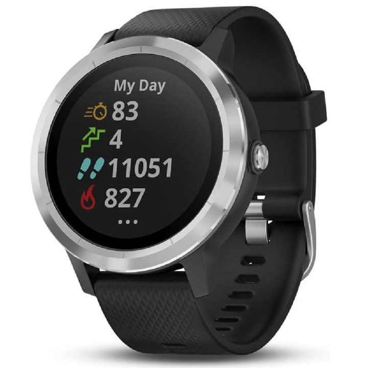 A Garmin smartwatch showing fitness metrics on the circular display.