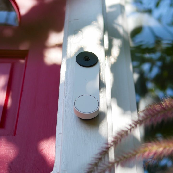Bottom view of Google Nest Doorbell (battery) on outside of door.