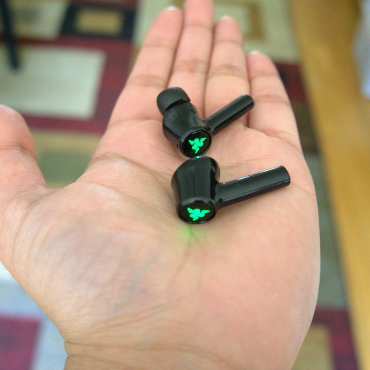 Razer Hammerhead held in palm.