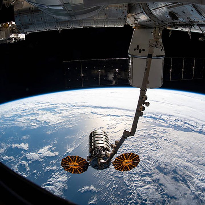 A Northrop Grumman Cygnus spacecraft is grabbed by the ISS's robotic arm.