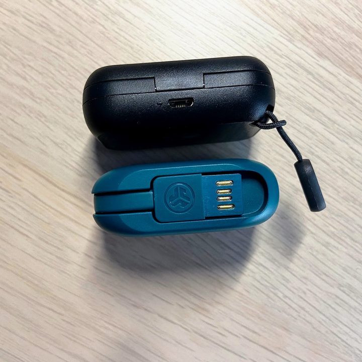 JLab Go Air Pop and Skullcandy Dime charging cases with charging ports or cables shown.