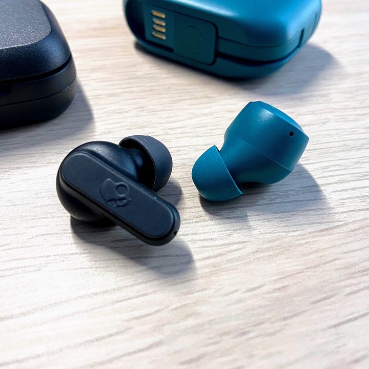 JLab Go Air Pop and Skullcandy Dime earbuds side by side.