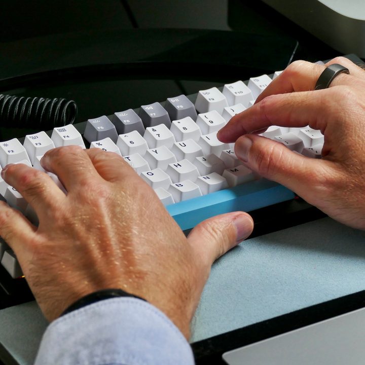 Typing on the Keychron Q1 mechanical keyboard.