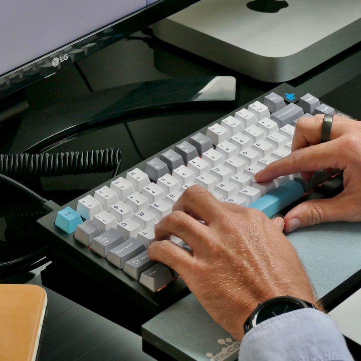 Typing on the Keychron Q1 mechanical keyboard.