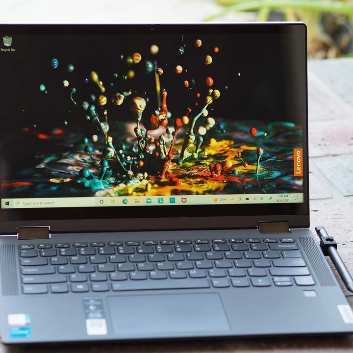 Image of an opened Lenovo IdeaPad Flex 5i 14 laptop sitting on the ground.