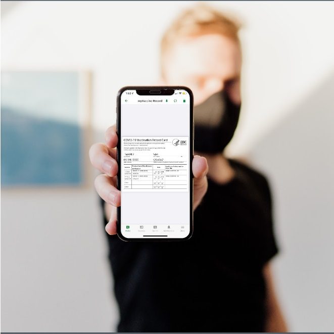 Man holding phone with myColorado app