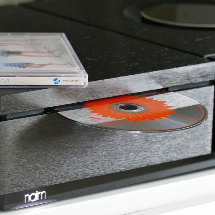 A CD from SKE48 in a CD drive.