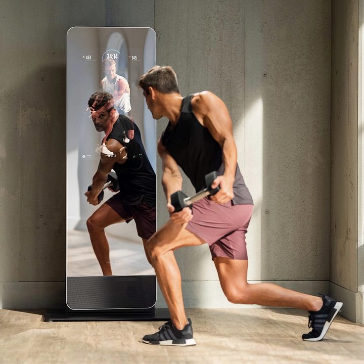 Man working out in front of NordicTrack Vault.
