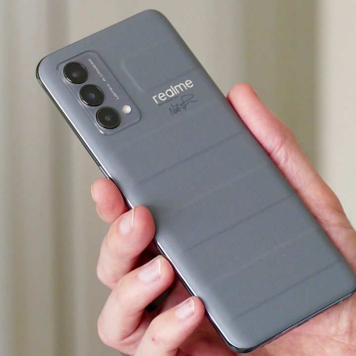 The Realme GT Master Edition in grey vegan leather seen from the back.