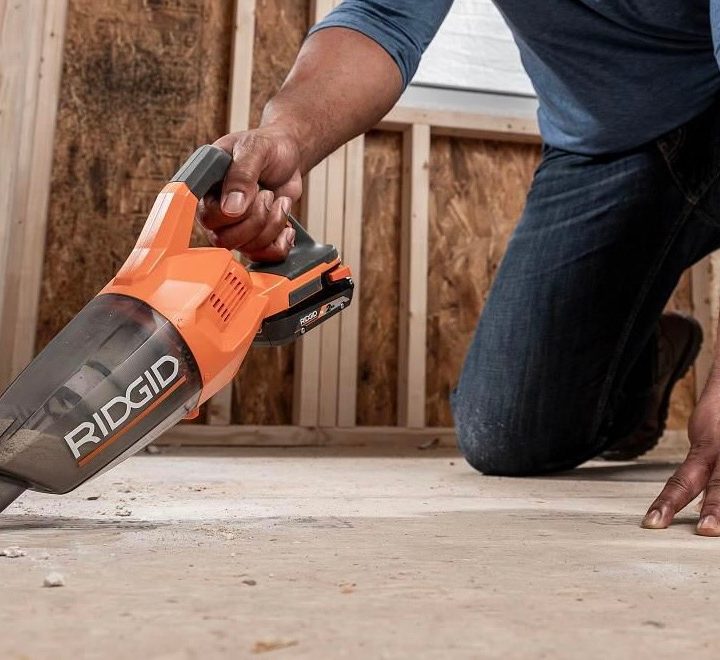 The Ridgid 18-Volt Handheld Vac being used to clean floors.
