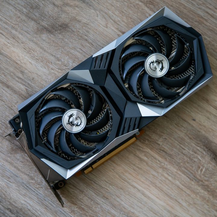 AMD RX 6600 XT on a wooden backdrop.
