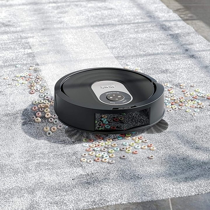 The Shark AI Vacmop cleaning rug and tile.
