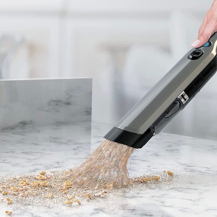 The Shark WV201 being used to clean off a kitchen counter.