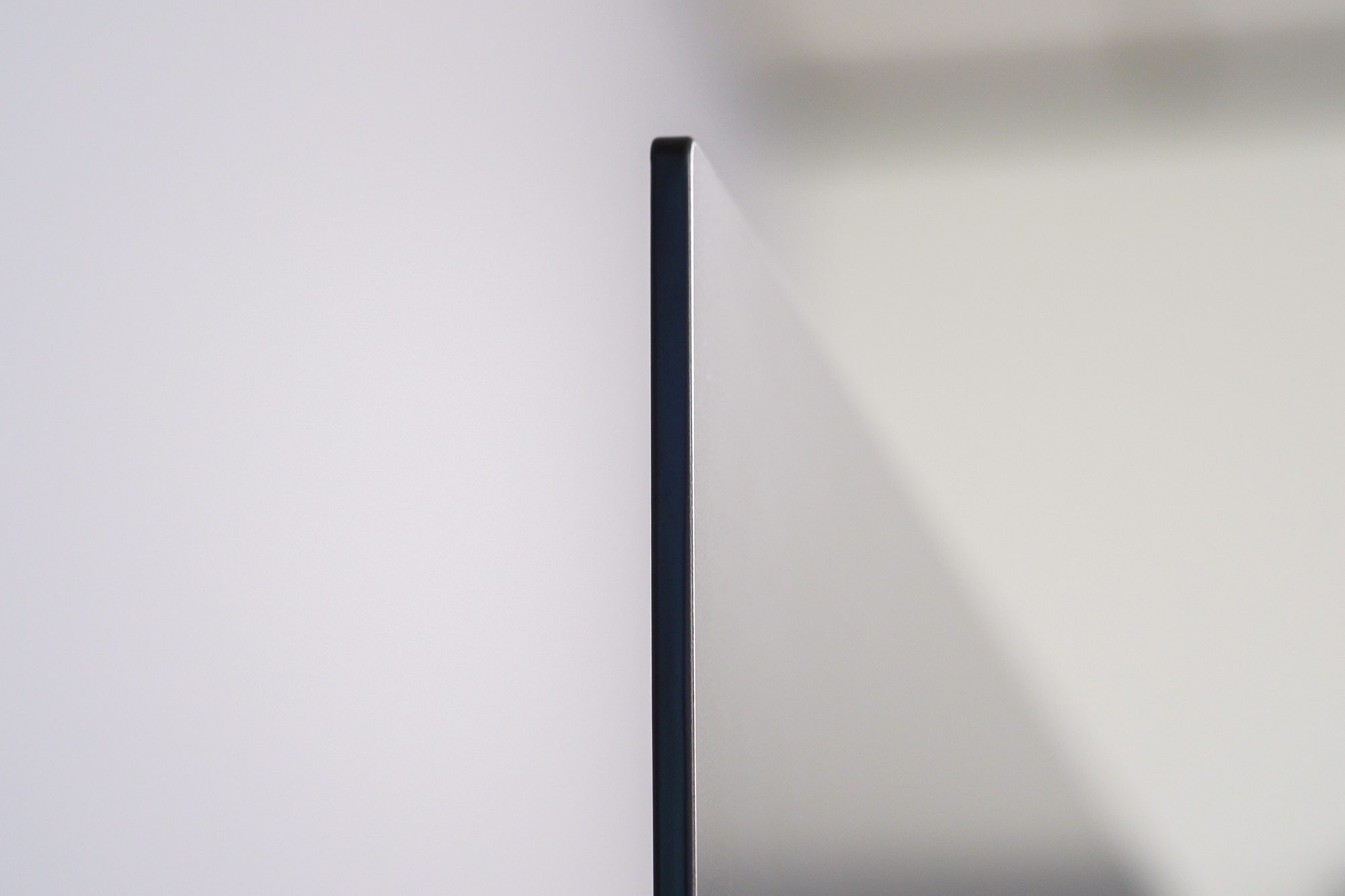 A side view of the Sony A80J 4K HDR OLED TV displaying just how thin the tv is.