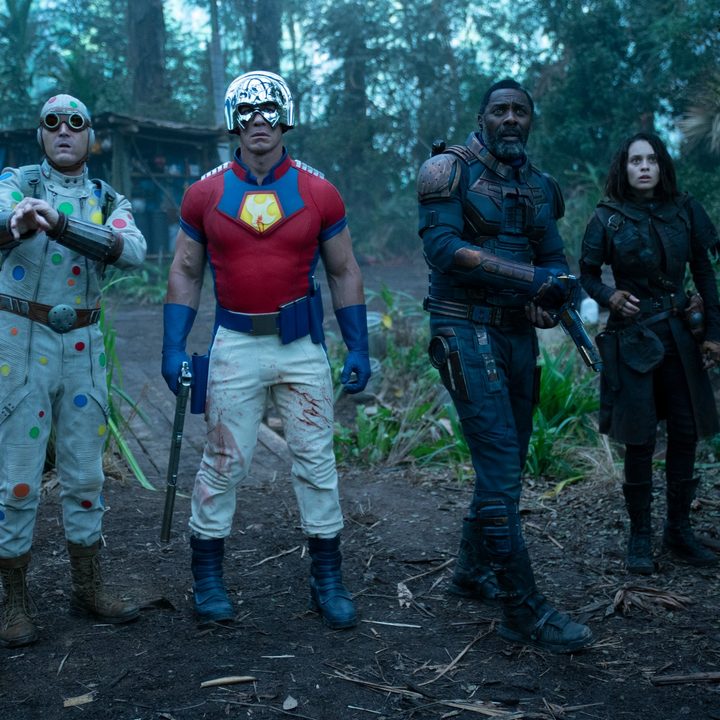 The cast of The Suicide Squad standing in the jungle.