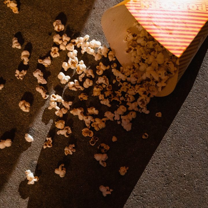 An image of popcorn spilled on a movie theater's floor.