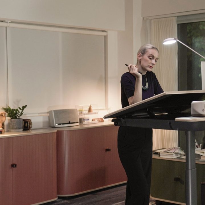 Ufou Upon smart standing desk in up position with angled top.