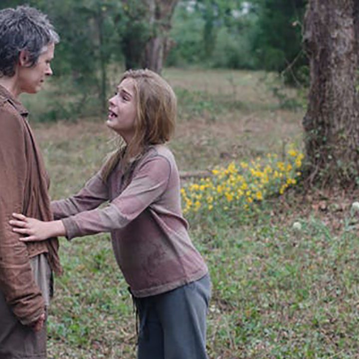 Lizzie pleading with Carol in a scene from The Walking Dead.