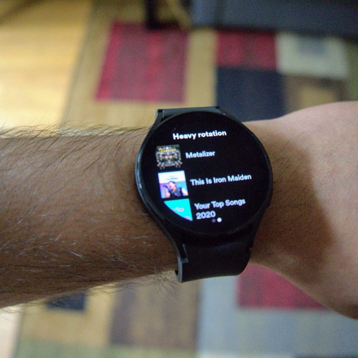 The Samsung Galaxy Watch 4 showing a Spotify playlist.