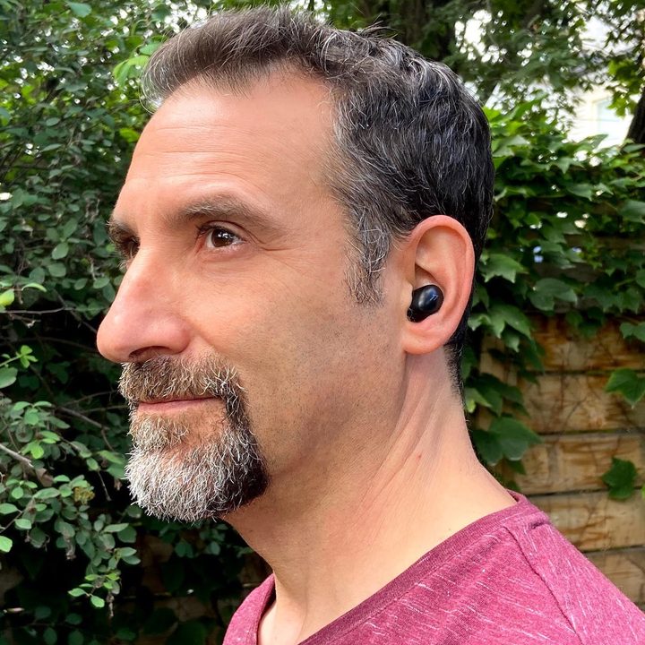 Man wearing 1More ColorBuds 2 true wireless earbuds.