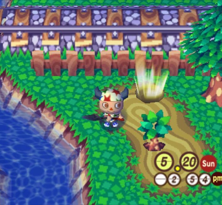 A player digs a shining bag of bells out of the ground.