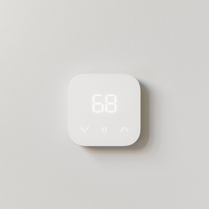 Amazon Smart Thermostat hanging on wall.