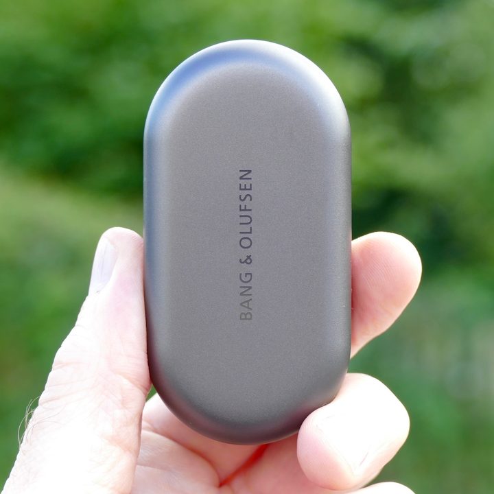 Holding the Beoplay EQ case.