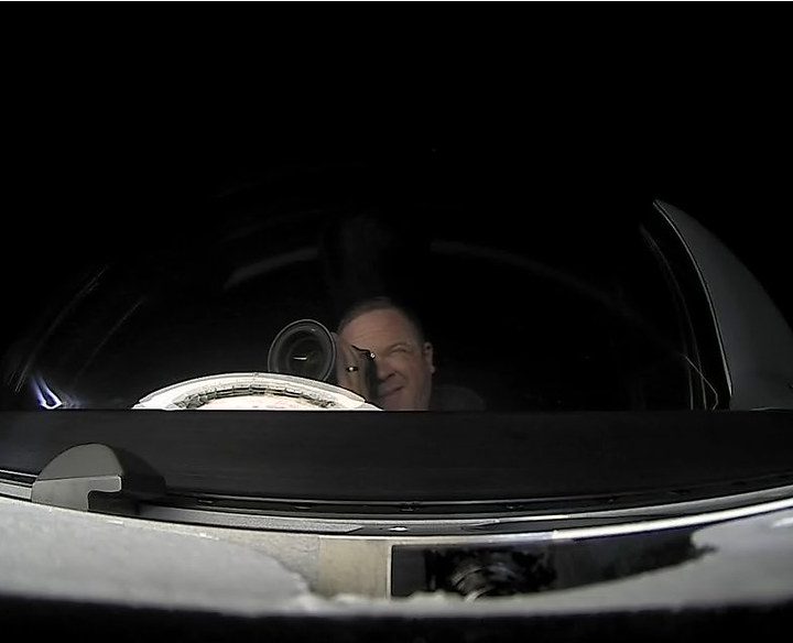 Chris Sembroski taking a photo from the Crew Dragon's cupola.