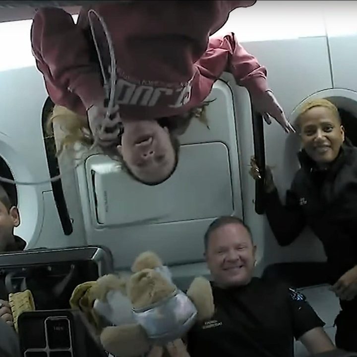 The Inspiration4 crew answering questions while in orbit aboard a SpaceX Crew Dragon spacecraft.