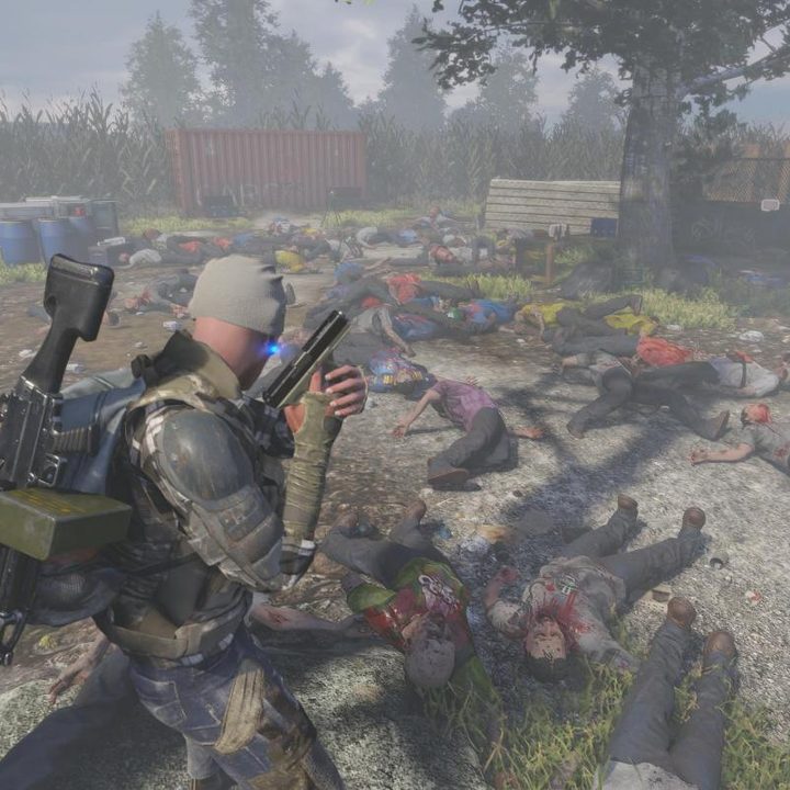 A man standing alone in a pile of dead zombies