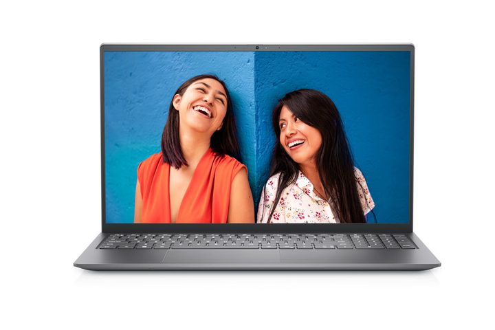 Dell Inspiron 15 Laptop sits open with the display showing two women leaning against a wall, looking at each other and laughing.