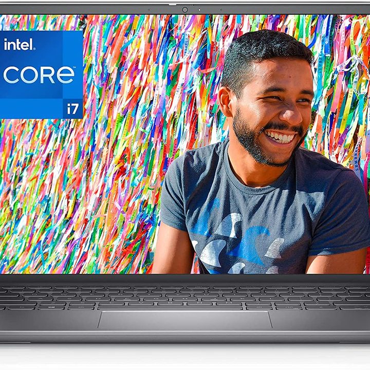 Dell Inspiron 3 QHD Laptop in black, open-faced, with colorful background and smiling man on the screen, against a white background.