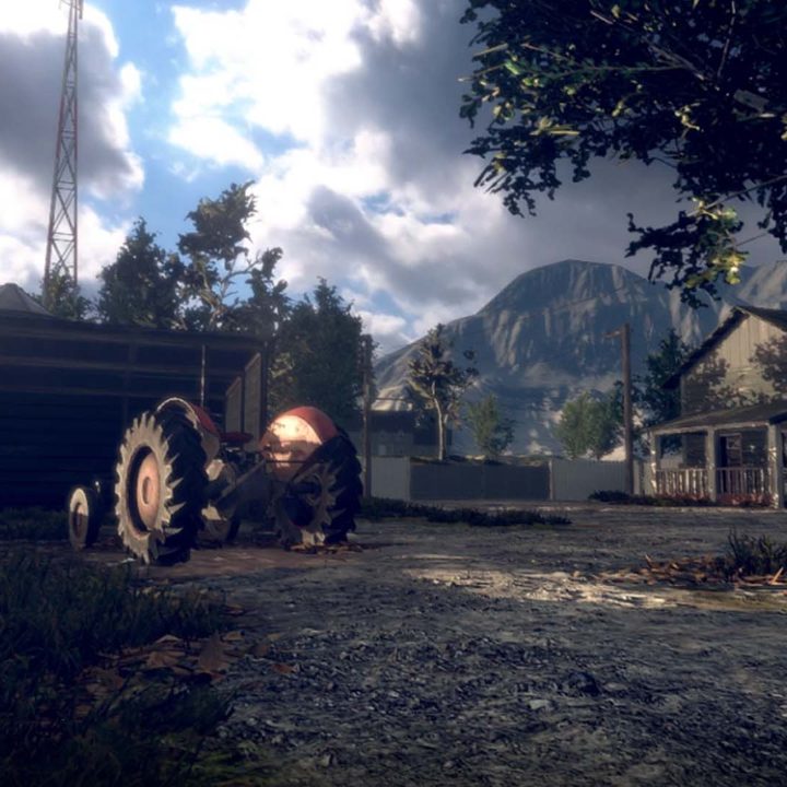 A tractor stands out in an abandoned farm