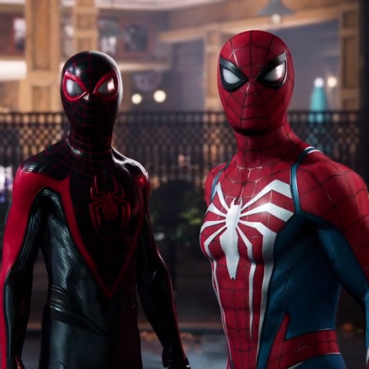 Miles Morales and Peter Parker stand together in Spider-Man 2.