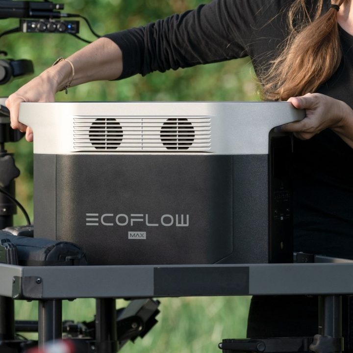 Woman adding EcoFlow Delta Max power station to stand.