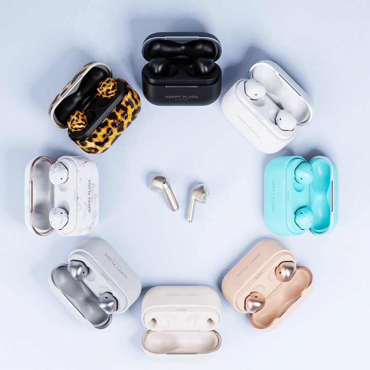 Happy Plugs Hope earbuds shown in a variety of colors.