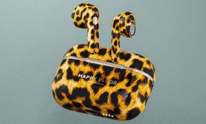 Happy Plugs Hope earbuds shown in a leopard print.
